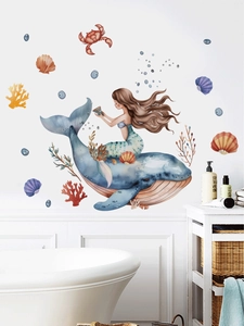 Detail of watercolor mermaid and whale wall decals in a bathroom setting
