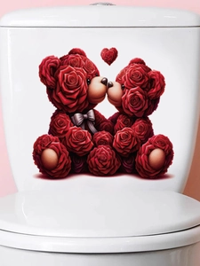 Close-up of red rose teddy bears heart sticker on a white ceramic toilet tank