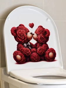 Detail of red rose heart bear toilet sticker decal on a white ceramic bathroom surface