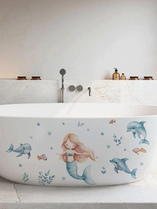 Stickers muraux sirène et dauphins sur une baignoire luxueuse en céramique blanche