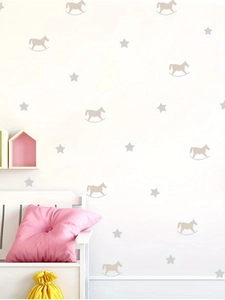 Detail showing self-adhesive rocking horse and star wall decals in a warm nursery setting