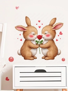 Détail de stickers muraux lapins avec cœurs et roses sur un mur blanc de salon épuré