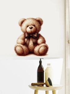 Detail of 3D teddy bear wall sticker with bow tie on bathroom wall above white bathtub