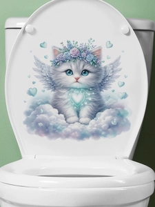 Close-up of a cute white angel cat sticker applied to a white toilet lid surface
