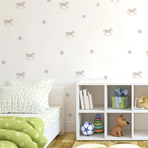 Minimalist rocking horse and star wall decals in a cozy, modern nursery setting