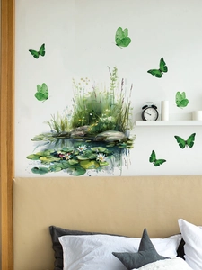 Detail showing green butterfly wall decals and pond landscape in a cozy bedroom setting