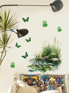 Detail of watercolor green butterflies and water plants wall stickers in a modern bedroom