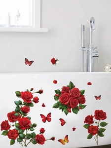 Macro detail of red rose and butterfly PVC wall decals applied on a white bathtub surface