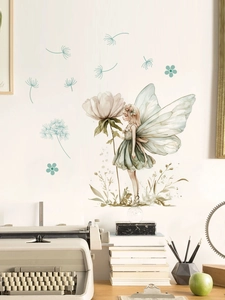 Detail of a watercolor floral fairy wall sticker on a white wall above a wooden desk