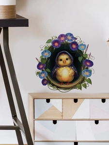 Detail of cute yellow chick wall sticker in floral frame on white wall decor