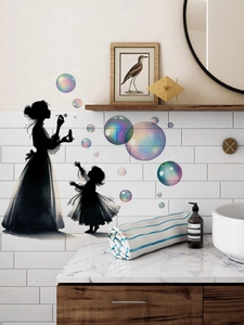 Detail of mother and daughter silhouette wall stickers with colorful bubbles on tile