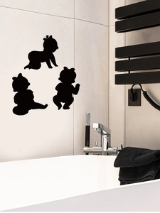 Three minimalist black vinyl baby silhouettes applied to bathroom wall tiles decor