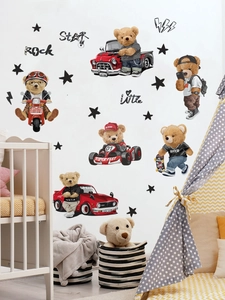 Detail of teddy bear wall stickers on a nursery wall with star and racing motifs