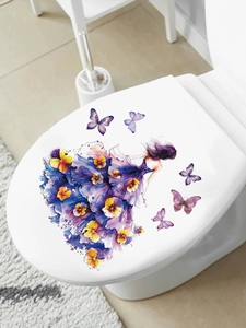 Detail view of floral girl and butterfly decal applied on a white toilet lid