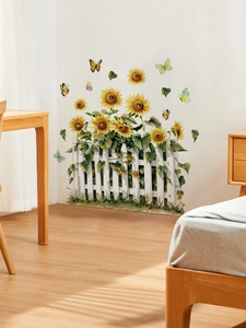 Detail of sunflower and fence wall decal with butterflies in a cozy bedroom setting