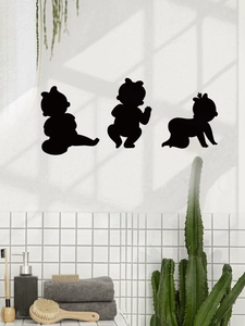 Three black baby silhouette wall decals showing sitting and crawling stages for nursery decor