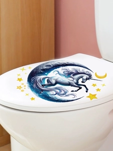 Détail d'un autocollant licorne magique et croissant de lune sur un couvercle de toilette