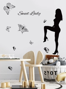 Detail of Sweet Lady silhouette wall sticker with black butterfly decals on a white wall