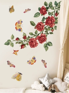Détail de stickers muraux roses rouges et papillons colorés pour décor de chambre