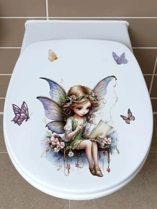Close-up of watercolor garden fairy and butterflies sticker on white toilet lid decor