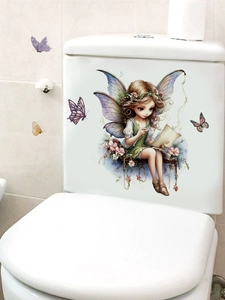 Floral fairy wall sticker decal applied on a white toilet tank in a modern bathroom