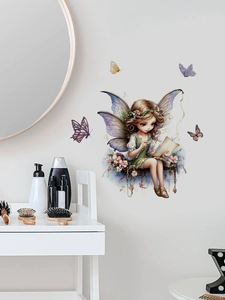 Detail of fairy wall decal with butterflies applied near a vanity mirror in bedroom
