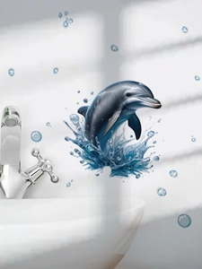 Close-up of 3D dolphin wall sticker with water splashes and bubbles on bathroom tile