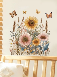 Detail view of sunflower and butterfly wall stickers on light wood bedroom furniture