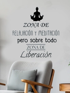 Close-up of black vinyl wall decal with yoga silhouette and Spanish text in a modern room