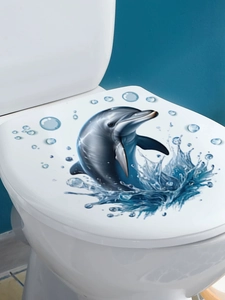 Detail view of a 3D blue dolphin wall sticker with water splashes on a white toilet lid