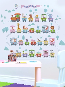 Close-up of animal alphabet train wall stickers with macaron colors in a kids bedroom
