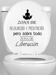 Detail of meditation silhouette and Spanish text sticker on a white toilet lid surface
