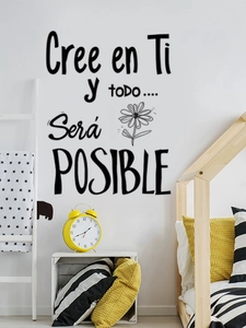 Detail of Spanish inspirational wall decal on a white wall in a cozy bedroom