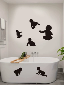 Detail showing six baby silhouettes wall stickers applied on a modern bathroom tub and wall