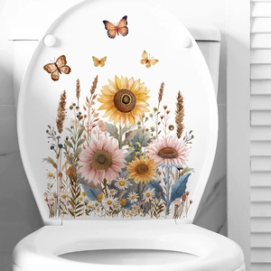 Adhesive sunflower and butterfly floral stickers on a white toilet lid for bathroom decor