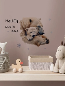 Detail showing polar bear mother and cub wall decals with blue snowflakes for nursery