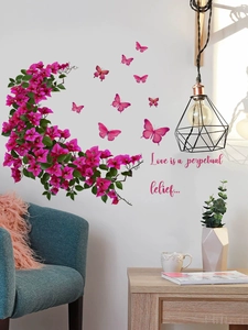 Détail de stickers muraux bougainvilliers roses avec papillons et lettrage artistique