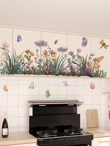 Detail showing floral wall stickers with purple dahlias and butterflies on kitchen tile