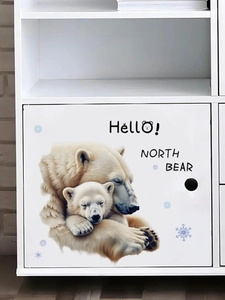 Detailed close-up of polar bear family wall decals with snowflakes on a white cabinet