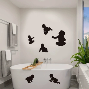 Black vinyl baby silhouette wall decals showing crawling poses for nursery bathroom decor