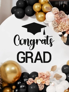 Close-up of graduation backdrop with Congrats GRAD lettering and elegant balloon arch decor