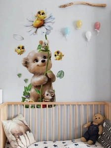 Detailed view of cartoon bear and hedgehog wall stickers in a nursery bedroom setting
