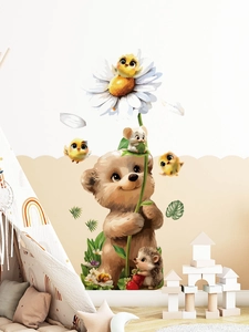 Detail of cute bear and hedgehog wall stickers in a cozy nursery room setting
