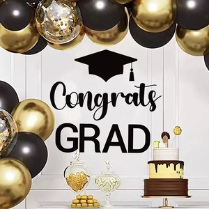 Black and gold graduation party set with Congrats Grad wall decal and balloon arch decor