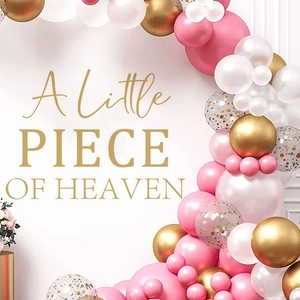 Pink and gold party balloon arch with A Little Piece of Heaven slogan for baby showers