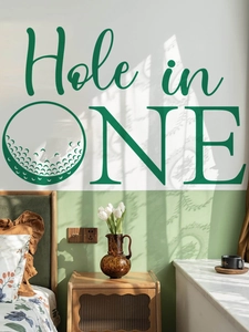 Detail of Hole in One golf themed wall decal on a green and white bedroom wall