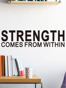Detail showing 'Strength Comes From Within' wall decal in black lettering on white wall