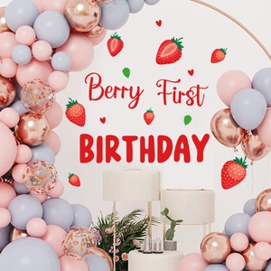 Strawberry-themed first birthday party balloon arch kit with Berry First Birthday signage