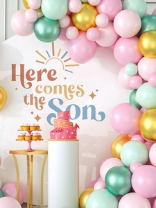 Detailed view of Here Comes The Son party backdrop with pastel balloon arch set