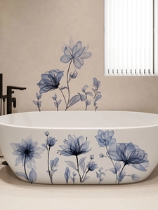 Detailed view of indigo blue X-ray floral wall stickers applied on a modern white bathtub